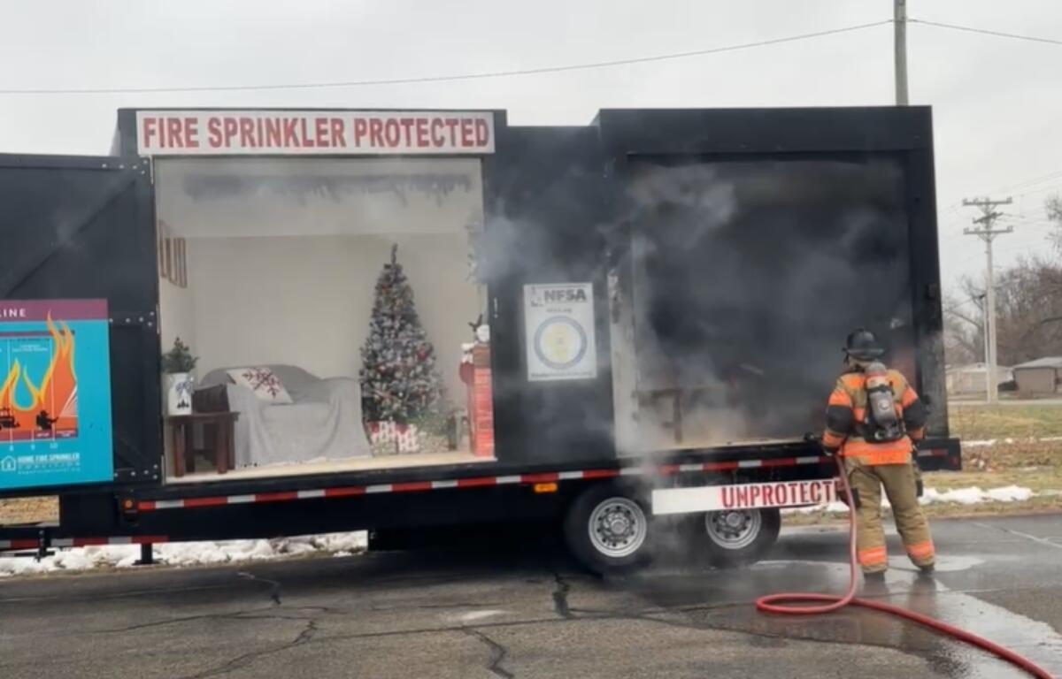 Officials demonstrate how quickly fires can burn during a news conference in December in Springfield.