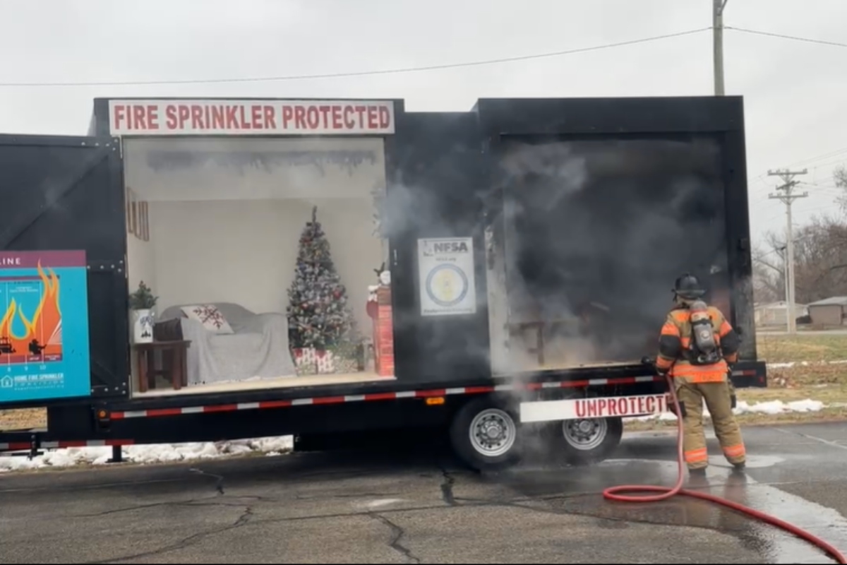 Officials demonstrate how quickly fires can burn during a news conference in December in Springfield.