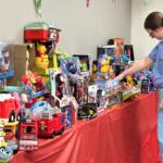 Melanie Barnard "shops" for presents in "Santa's Workshop" at HSHS St. John's Children's Hospital. Barnard's son Stuart is recovering there after recent surgery.