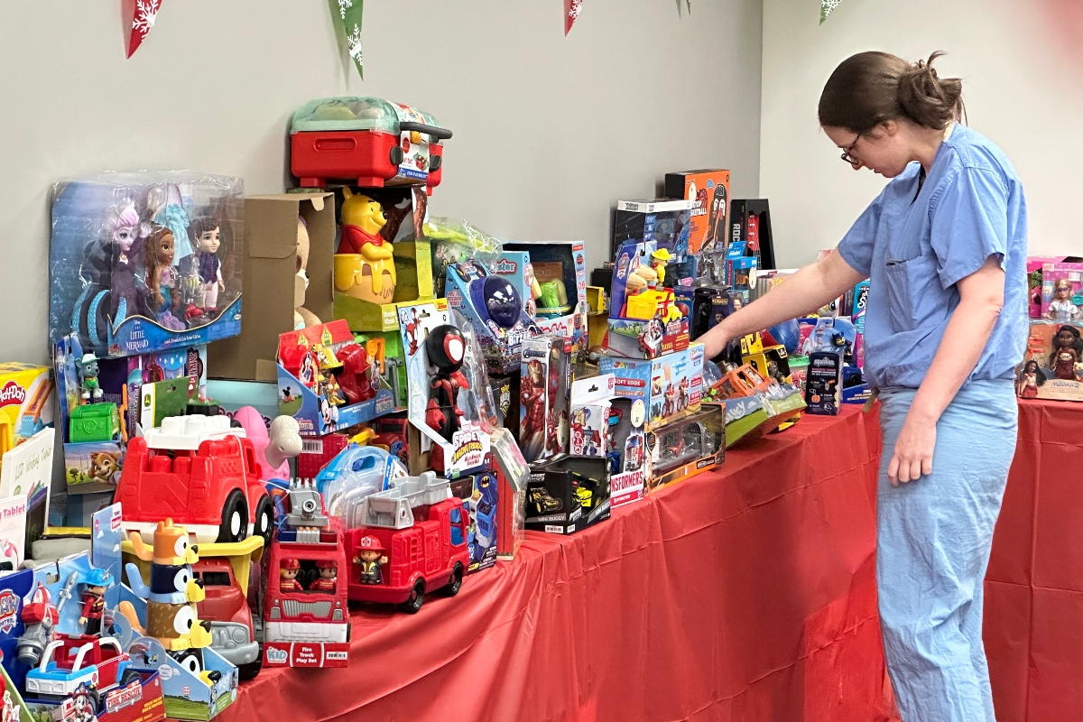 Melanie Barnard "shops" for presents in "Santa's Workshop" at HSHS St. John's Children's Hospital. Barnard's son Stuart is recovering there after recent surgery.