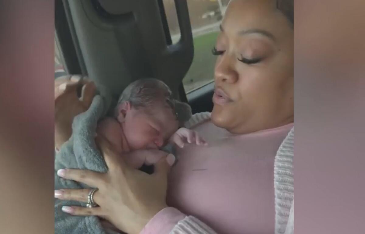 A screenshot of a video taken by the Wells family after Mercedes Wells gave birth to a baby, following being discharged from a hospital.