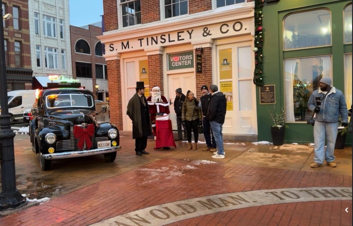 Santa, Abraham Lincoln, and others prepare for a tree lighting ceremony last week at the Old State Capitol Plaza downtown.