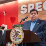 Gov. JB Pritzker speaks at a Springfield grocery store in 2022 in favor of temporarily eliminating the state’s grocery tax. Four years later, the tax will end permanently, at least statewide. (Capitol News Illinois file photo by Jerry Nowicki)