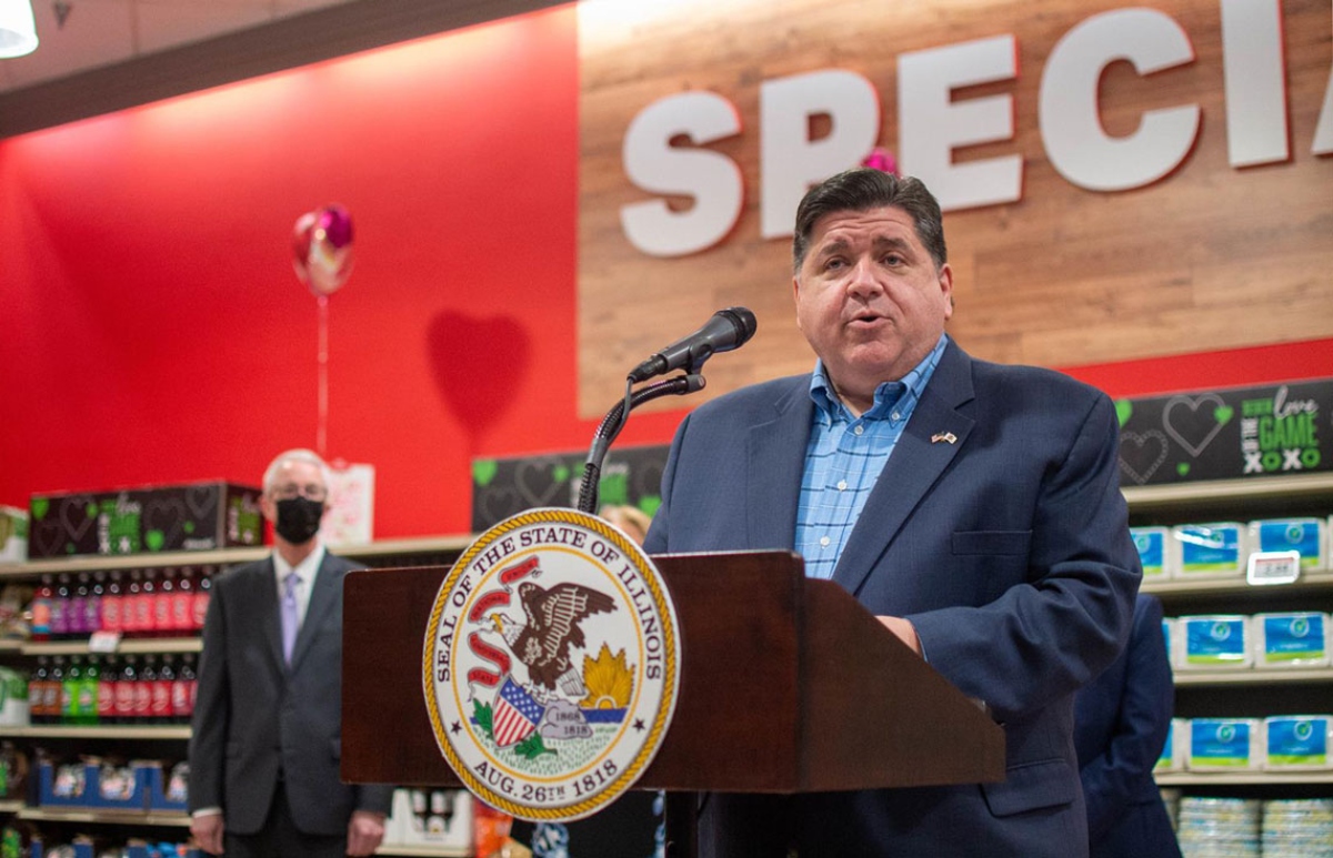 Gov. JB Pritzker speaks at a Springfield grocery store in 2022 in favor of temporarily eliminating the state’s grocery tax. Four years later, the tax will end permanently, at least statewide. (Capitol News Illinois file photo by Jerry Nowicki)