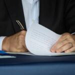 Gov. JB Pritzker signs a bill into law on Aug. 14, 2025, in Springfield. (Capitol News Illinois photo by Jerry Nowicki)