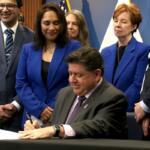 Gov. JB Pritzker signs House Bill 767 at a Dec. 2 news conference in Chicago. He said the bill will protect Illinoisians using science-backed guidelines, rather than “junk science” used by the federal administration under the guidance of Health and Human Services Secretary Robert F. Kennedy Jr. (CNI photo by Maggie Dougherty)