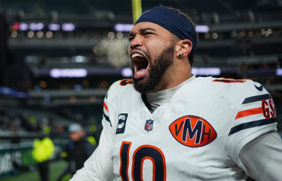 Chicago Bears quarterback Caleb Williams (18) celebrates his team's win over the Philadelphia Eagles in an NFL football game, Friday, Nov. 28, 2025, in Philadelphia. (AP Photo/Matt Slocum)