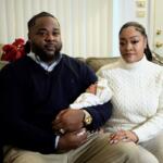 Leon and Mercedes Wells hold their newborn daughter Alena at their home in the Chicago suburb of Dolton, Ill. on Friday, Nov. 28, 2025. (AP Photo/Mark Vancleave)