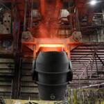 FILE - A giant ladle glows red after pouring molten iron in to a vessel inside the basic oxygen furnace as part of the processes of making steel at the U.S. Steel Granite City Works facility Thursday, June 28, 2018, in Granite City, Ill. (AP Photo/Jeff Roberson, File)