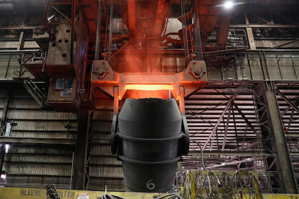 FILE - A giant ladle glows red after pouring molten iron in to a vessel inside the basic oxygen furnace as part of the processes of making steel at the U.S. Steel Granite City Works facility Thursday, June 28, 2018, in Granite City, Ill. (AP Photo/Jeff Roberson, File)