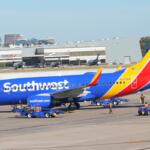 FILE - A Southwest Airlines jet pulls into a gate at Dallas Love Field Airport Tuesday, Nov. 11, 2025, in Dallas. (AP Photo/LM Otero, File)