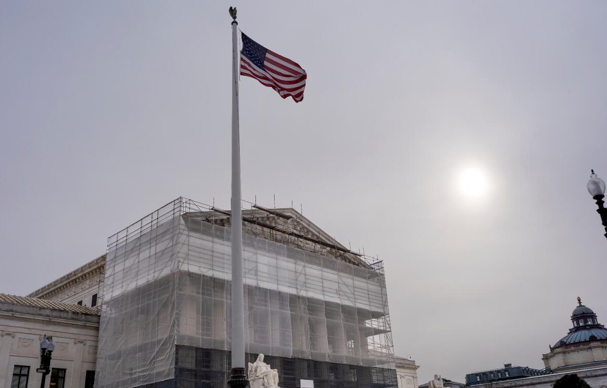 With the Supreme Court Building under renovations, the justices hear oral arguments on President Donald Trump's push to expand control over independent federal agencies, on Capitol Hill in Washington, Monday, Dec. 8, 2025. (AP Photo/J. Scott Applewhite)