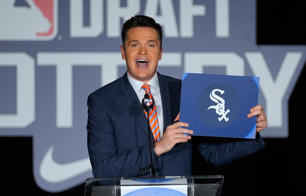 Greg Amsinger, MLB Network host, announces that the Chicago White Sox will have the number one pick in draft during a broadcast at the Major League Baseball's winter meetings, Tuesday, Dec. 9, 2025, in Orlando, Fla. (AP Photo/John Raoux)