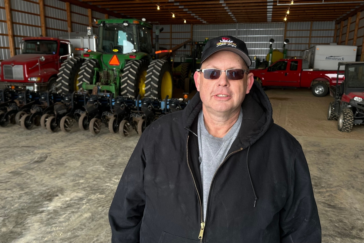 Charlie Radman, a corn and soybean farmer, stands for a photo on the land his family has owned since 1899, near Randolph, Minn., Wednesday, Dec. 10, 2025. (AP Photo/Mark Vancleave)