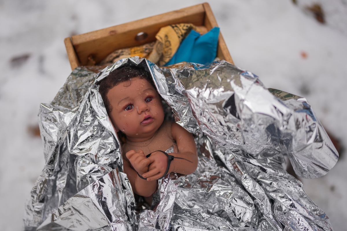 A doll representing the baby Jesus is zip-tied in the Nativity scene outside of Lake Street Church of Evanston, Wednesday, Dec. 10, 2025, in Evanston, Ill. (AP Photo/Erin Hooley)