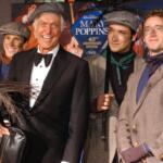 FILE - Dick Van Dyke poses with chimney sweeps during arrivals to the 40th anniversary and re-premiere of Mary Poppins at the El Capitan Theatre in Los Angeles, Tuesday, Nov. 30, 2004. (AP Photo/Ann Johansson, File)