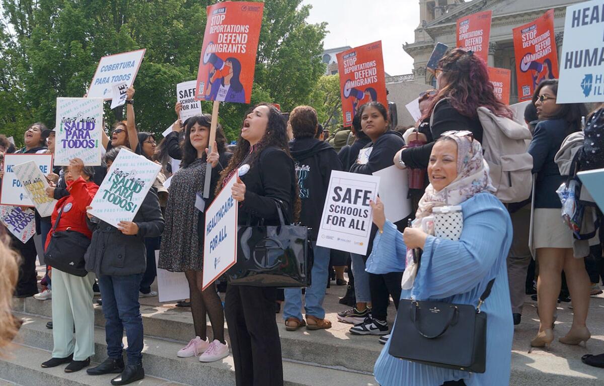 Immigrant rights advocates demonstrate outside the Illinois Statehouse in Springfield in May, 2025, urging passage of legislation to guarantee all children the right to a free public education regardless of their immigration or citizenship status. (Capitol News Illinois photo by Peter Hancock)