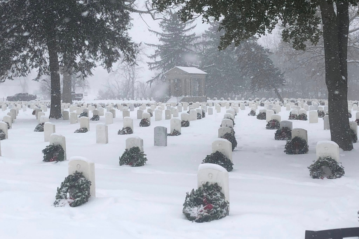 Several hundred wreaths were laid at the gravestones of veterans at Camp Butler National Cemetery Saturday as part of "Wreaths Across America."