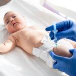 A newborn getting a vaccine.