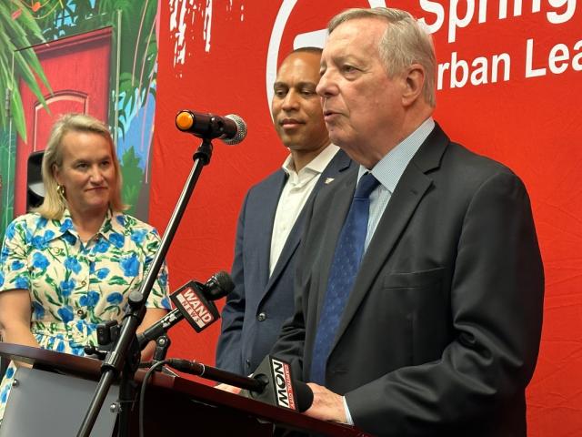 Rep. Nikki Budzinski, House Minority Leader Hakeem Jeffries, and Sen. Dick Durbin speak in 2025 at the Springfield Urban League.