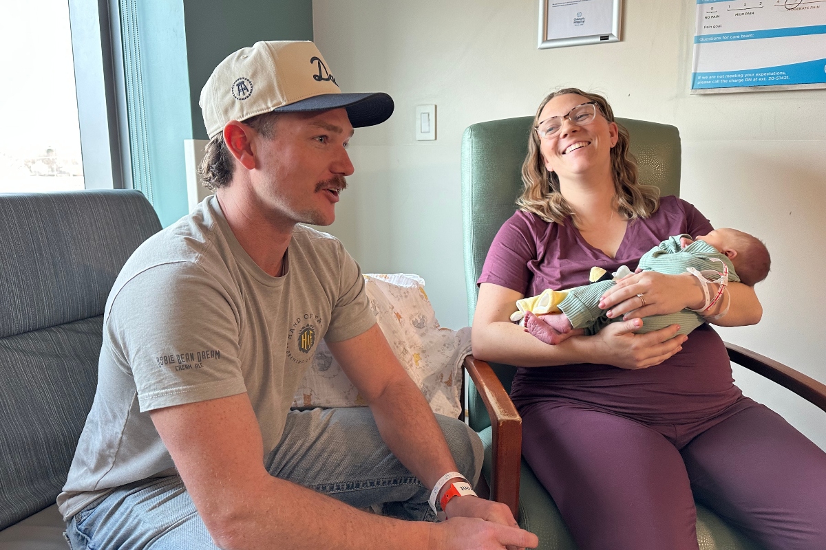 Matt, Amy, and baby Theodore Barker after being the first family to give birth in Springfield in 2026. Well, Theodore had no comment.