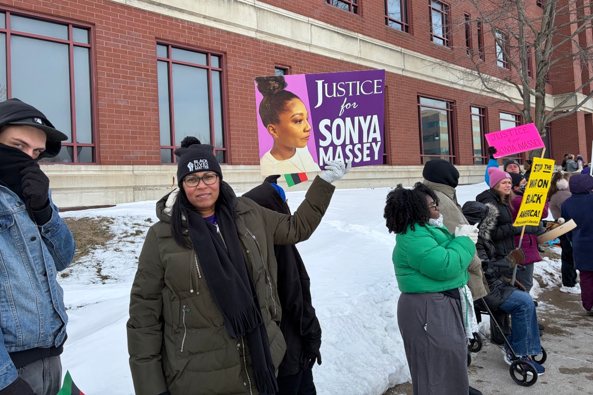 Rally-goers gather outside of the Sangamon County Complex during Thursday's sentencing hearing for Sean Grayson.