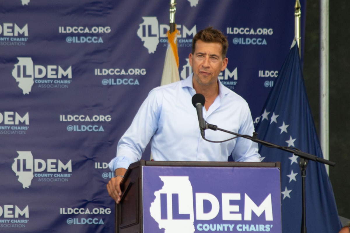 Alexi Giannoulias, now the Illinois secretary of state, speaks at a Democratic Party event in 2021. He’s being sued over a 40-year-old law governing which companies can use the word “Democrat” or “Republican” in their name. (Capitol News Illinois photo by Jerry Nowicki)