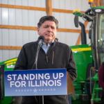 Gov. JB Pritzker listens to a question from a reporter during a news conference at a farm in Central Illinois on Oct. 29, 2025. (Capitol News Illinois photo by Jerry Nowicki)