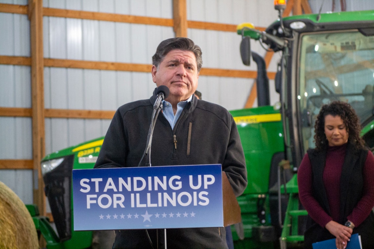 Gov. JB Pritzker listens to a question from a reporter during a news conference at a farm in Central Illinois on Oct. 29, 2025. (Capitol News Illinois photo by Jerry Nowicki)