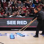 United Center employees clean the court during a delay before an NBA basketball game against the Miami Heat in Chicago, Thursday, Jan. 8, 2026. (AP Photo/Nam Y. Huh)
