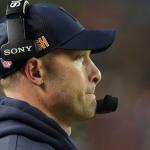 Chicago Bears head coach Ben Johnson watches during the first half of an NFL wild-card playoff football game against the Green Bay Packers Saturday, Jan. 10, 2026, in Chicago. (AP Photo/Nam Huh)
