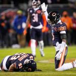 Chicago Bears' Jaquan Brisker calls for help as T.J. Edwards is injured during the first half of an NFL wild-card playoff football game against the Green Bay Packers Saturday, Jan. 10, 2026, in Chicago. (AP Photo/Erin Hooley)