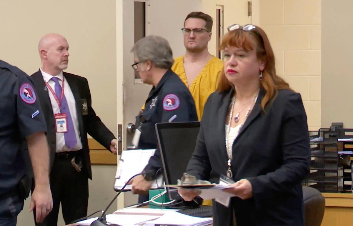 This image taken from video shows Michael David McKee walking into the courtroom on Monday, Jan. 12, 2026, in Rockford, Ill. (WIFR News/Pool Photo via AP)