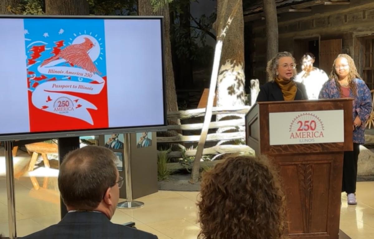 Gabrielle Lyon, Ph.D., chair of the Illinois 250 Coalition, unveils a "Passport to Illinois" Wednesday, February 11, at the Abraham Lincoln Presidential Library and Museum.
