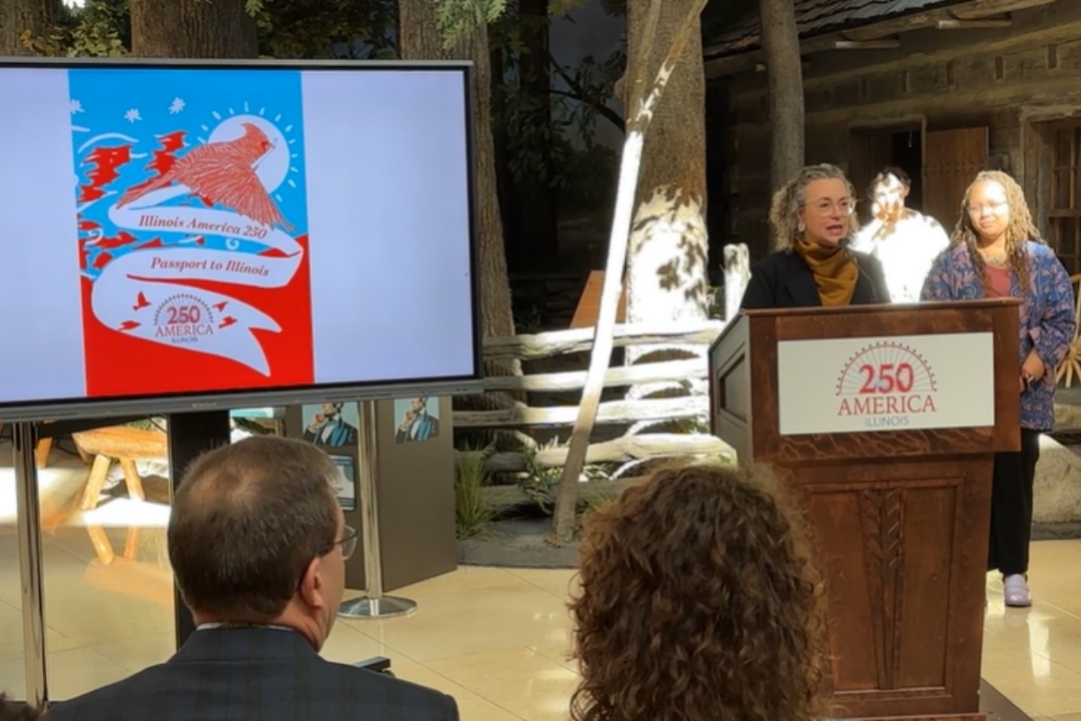 Gabrielle Lyon, Ph.D., chair of the Illinois 250 Coalition, unveils a "Passport to Illinois" Wednesday, February 11, at the Abraham Lincoln Presidential Library and Museum.