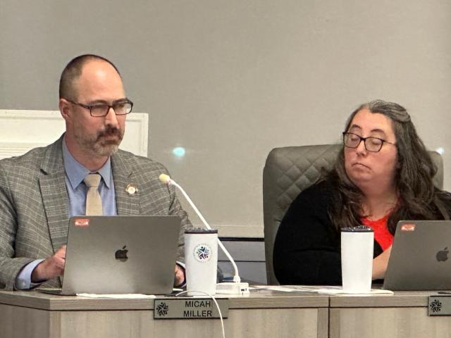 Board member Sarah Blissett listens as board member Micah Miller makes a point at a school board meeting Feb. 18, 2026.