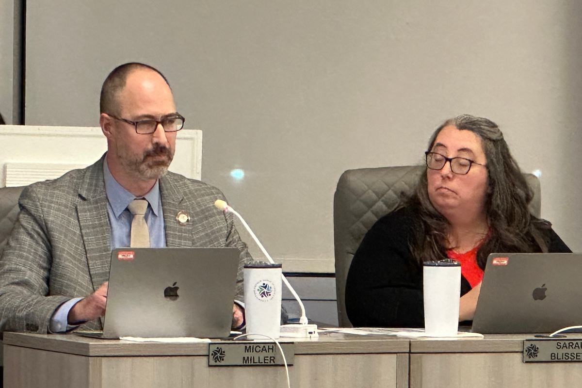 Board member Sarah Blissett listens as board member Micah Miller makes a point at a school board meeting Feb. 18, 2026.