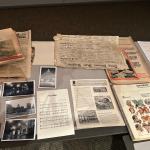 Newspapers, photographs, a phone book, and other items were in a time capsule buried in 1976, opened Monday on the occasion of the Lincoln Library's 140th birthday.