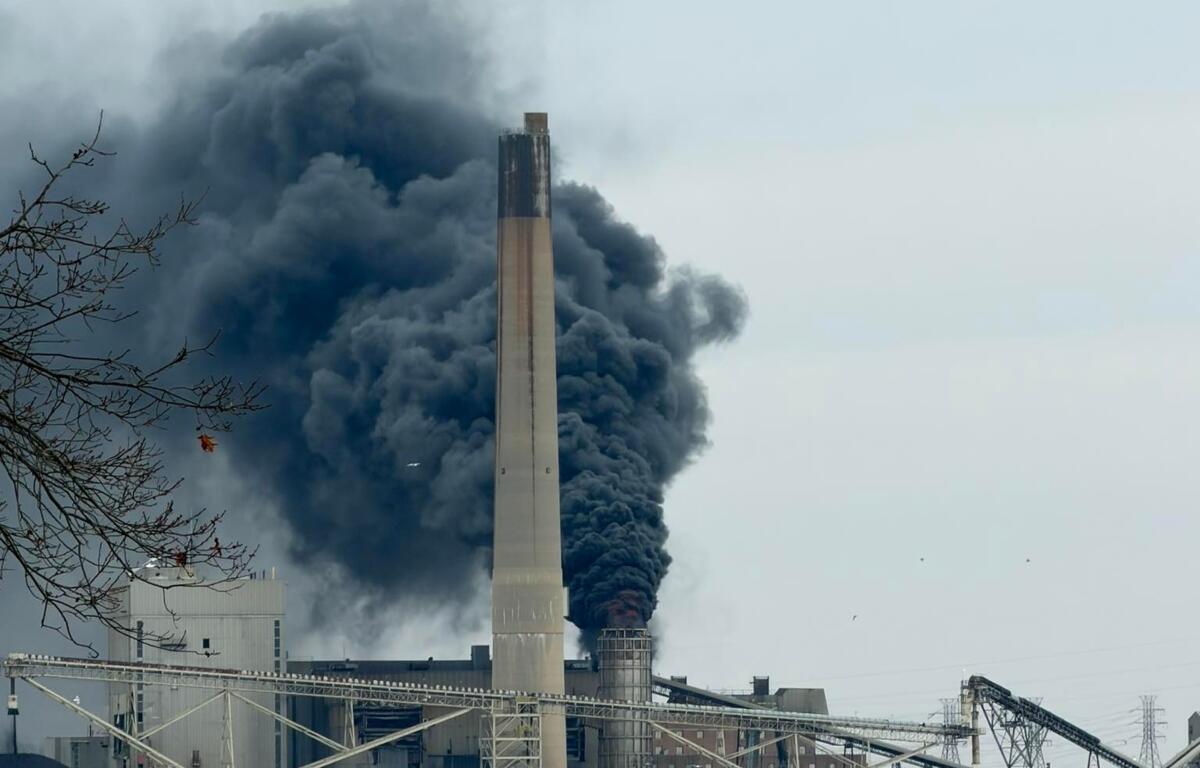 Fire and thick black smoke can be seen coming from a smokestack at CWLP Tuesday morning.