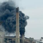 Fire and thick black smoke can be seen coming from a smokestack at CWLP Tuesday morning.