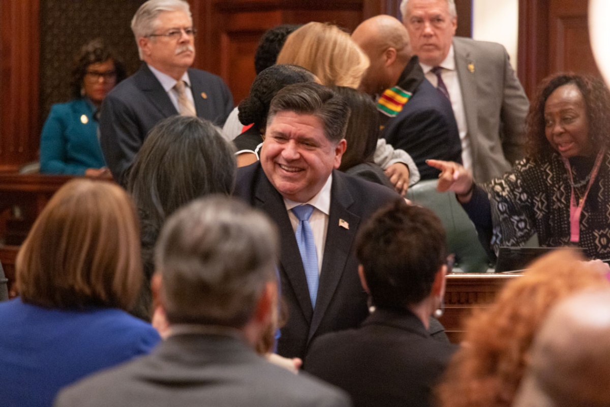 Gov. JB Pritzker enters the House chamber for his 2025 budget address. (Capitol News Illinois file photo by Andrew Adams)