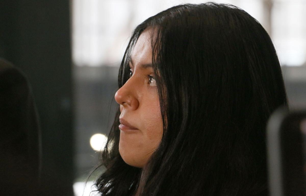 Marimar Martinez looks at her attorney with tears in her eyes as he speaks to press about the lingering impact the shooting has had on her after a Feb. 6, 2026, hearing to modify the protective order sealing evidence in her case. (Capitol News Illinois photo by Maggie Dougherty)