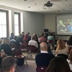 Lobbyists with a variety of health and human service organizations across Illinois watch Gov. Pritzker’s annual budget address at the Illinois State Library Wednesday, Feb. 18, 2026. (Medill Illinois News Bureau by George Alexandrakis)