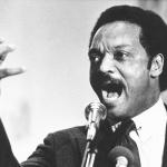 FILE - Democratic presidential primary candidate Jesse Jackson speaks to a group of his supporters at a rally held at a Baptist Church in Dayton, Ohio, April 14, 1984. (AP Photo/Rob Burns, File)