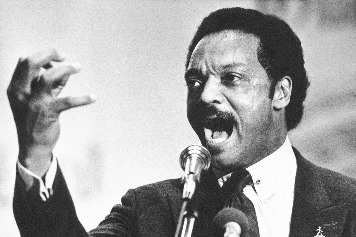 FILE - Democratic presidential primary candidate Jesse Jackson speaks to a group of his supporters at a rally held at a Baptist Church in Dayton, Ohio, April 14, 1984. (AP Photo/Rob Burns, File)