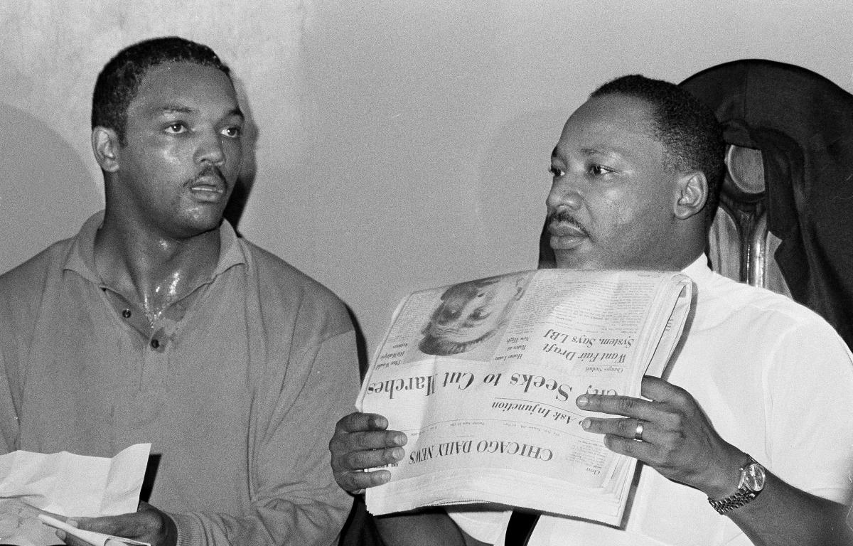 FILE - Civil rights leader Dr. Martin Luther King, Jr., right, and his aide Rev. Jesse Jackson are seen in Chicago, Aug. 19, 1966. (AP Photo/Larry Stoddard, File)