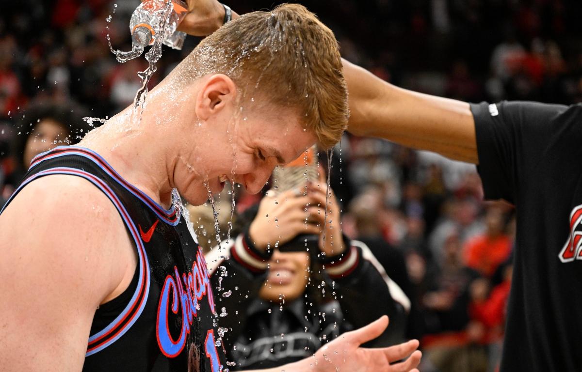 Chicago Bulls guard Kevin Huerter gets doused with water after an NBA basketball game against the Boston Celtics, Saturday, Jan. 24, 2026, in Chicago. Huerter scored the game winning three-point basket. (AP Photo/Matt Marton)