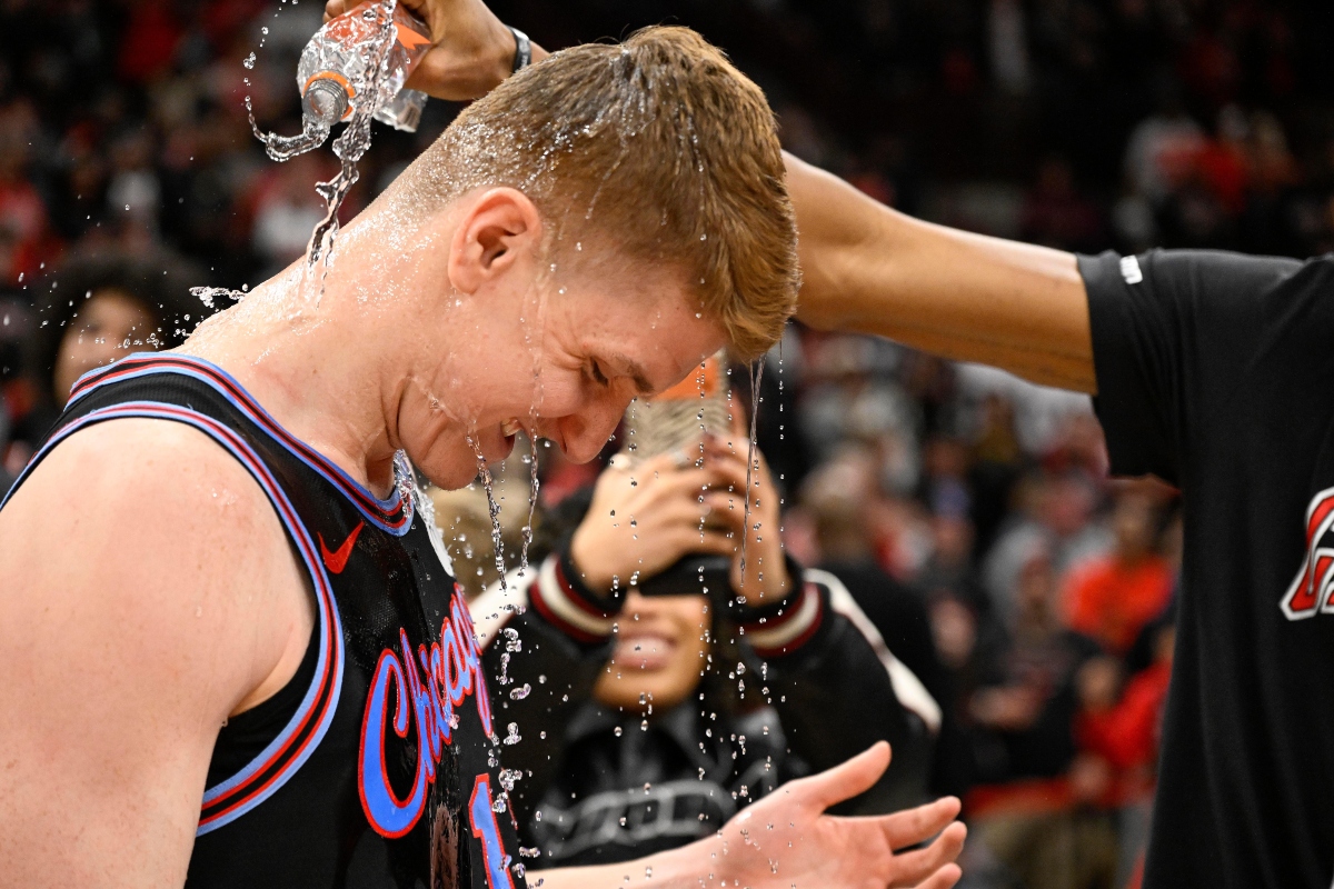 Chicago Bulls guard Kevin Huerter gets doused with water after an NBA basketball game against the Boston Celtics, Saturday, Jan. 24, 2026, in Chicago. Huerter scored the game winning three-point basket. (AP Photo/Matt Marton)