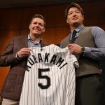 FILE - Newly acquired Chicago White Sox infielder Munetaka Murakami, right, poses with Chicago White Sox executive vice president/ general manager Chris Getz, left, at Rate Field during a press conference Monday, Dec. 22, 2025, in Chicago. (AP Photo/Paul Beaty, File)