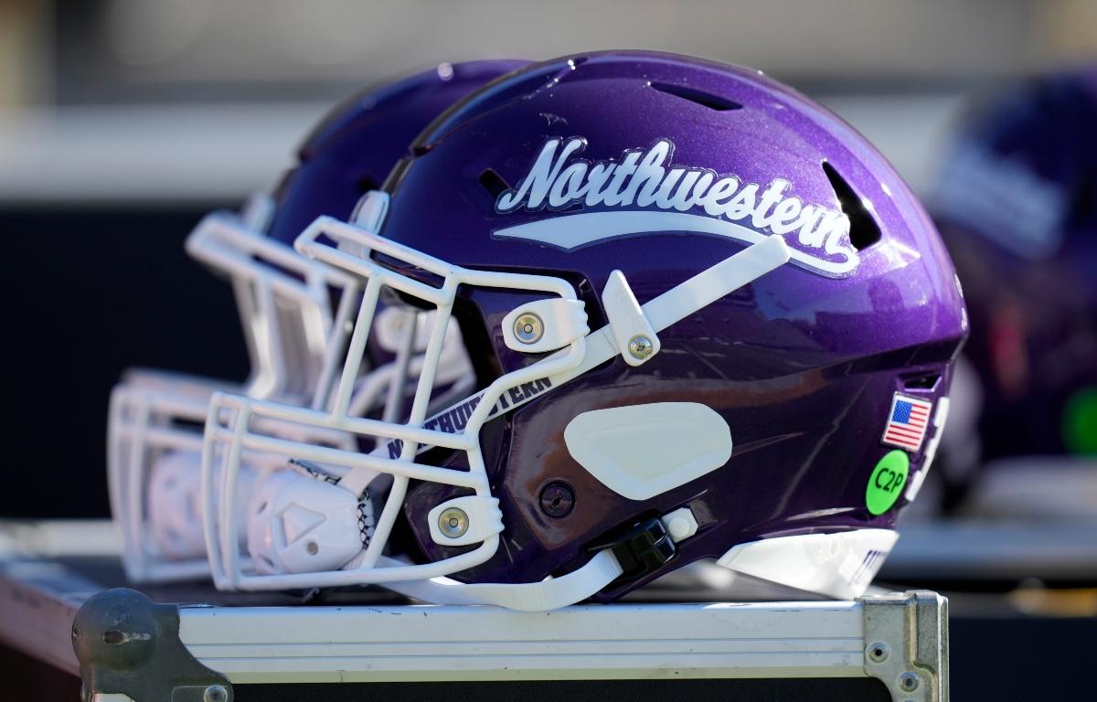 FILE - A Northwestern helmet is seen on the bench before an NCAA college football game against Iowa, Oct. 26, 2024, in Iowa City, Iowa. (AP Photo/Charlie Neibergall, File)